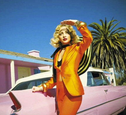 34SBeditor2-Nicole-Richie-Harper-Bazaar-Orange-Suit-769×1024